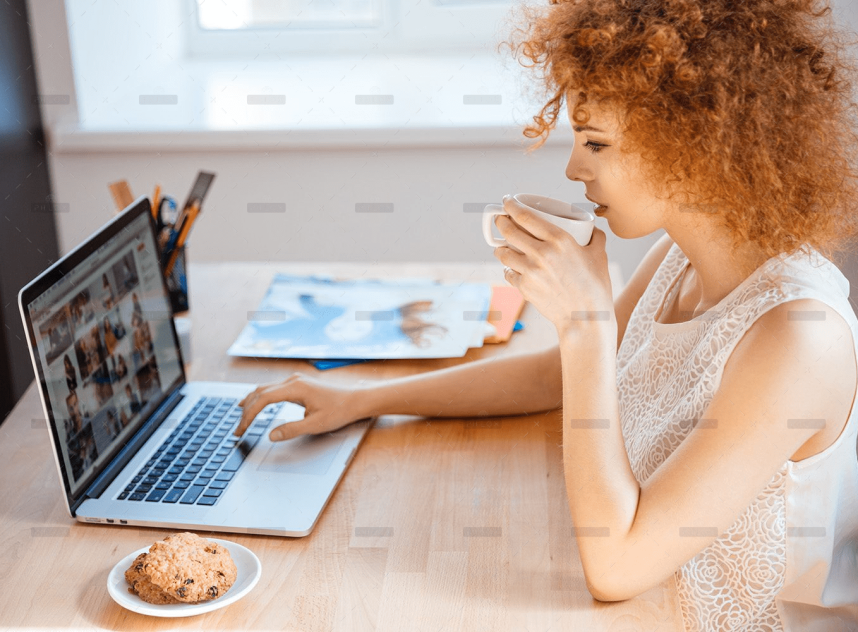 woman-photographer-drinking-coffee-and-working-PJNBP6U.png